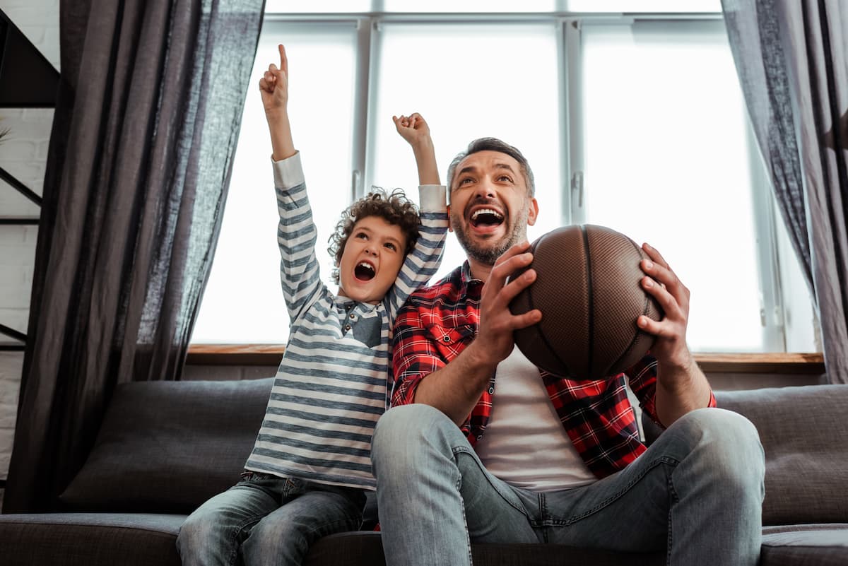 Father and son cheering on their favorite team