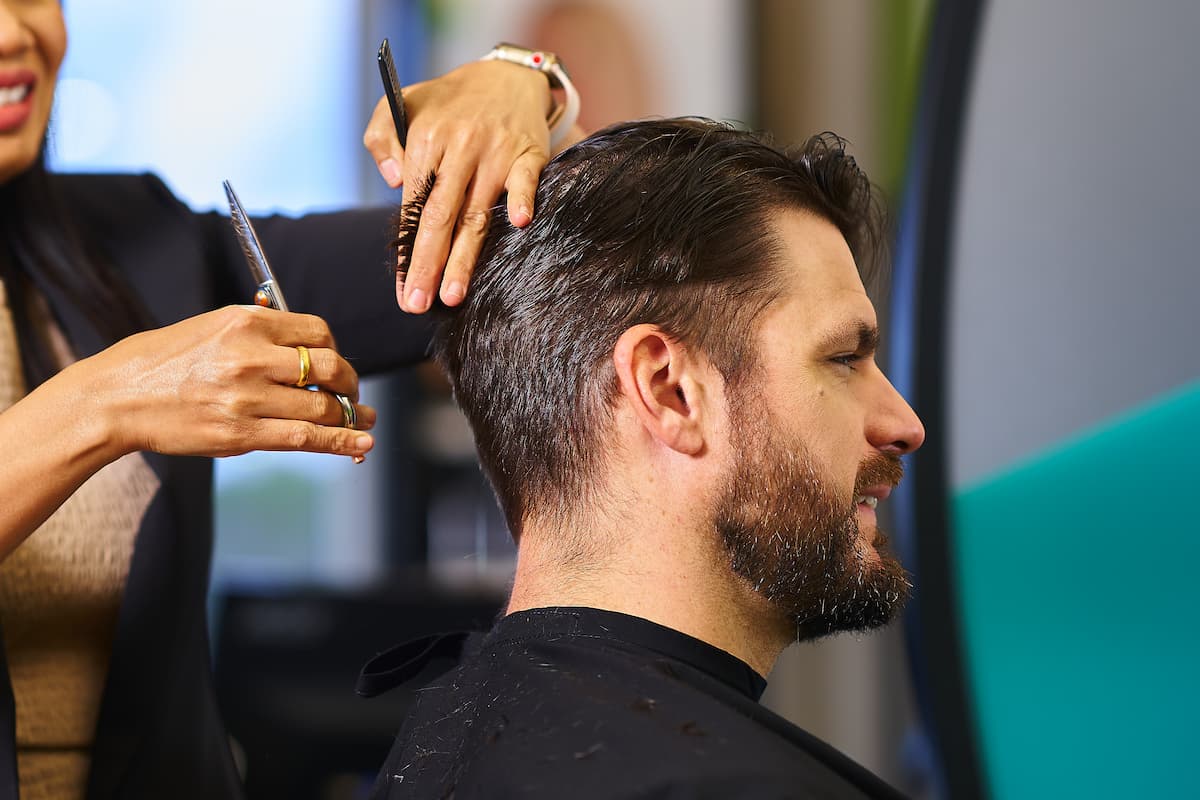 Man getting his hair cut by a Great Clips stylist